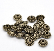 Бусины металлические "Круглые с точками" бронза, 11х5 мм (2 шт)